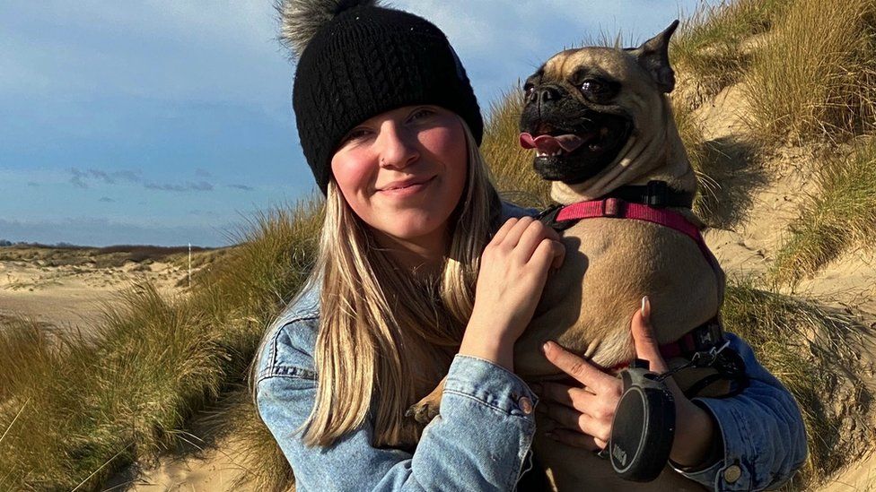 Jessica Poole and her dog on the beach