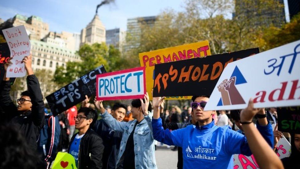 People take part in a rally in support of DACA and TPS on 26 October, 2019 in New York City.