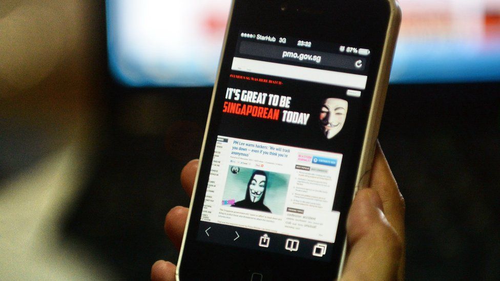 Activist hacker group Anonymous is seen through the internet government website of Singapore Prime Minister Office circulated online on a smartphone in Singapore on November 7, 2013.
