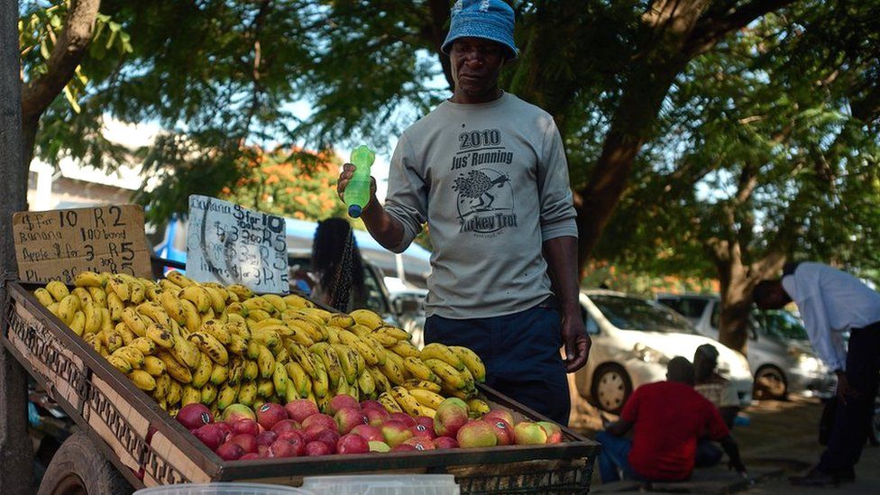 Noel Ngwenya next to his fruit stall