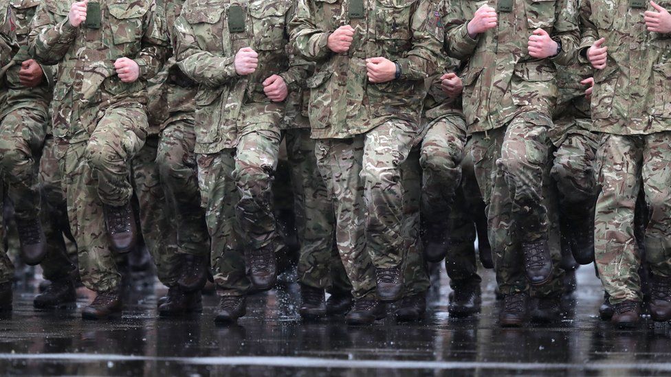 Troops training in the rain