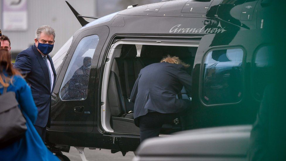 Boris Johnson and Brandon Lewis getting into a helicopter