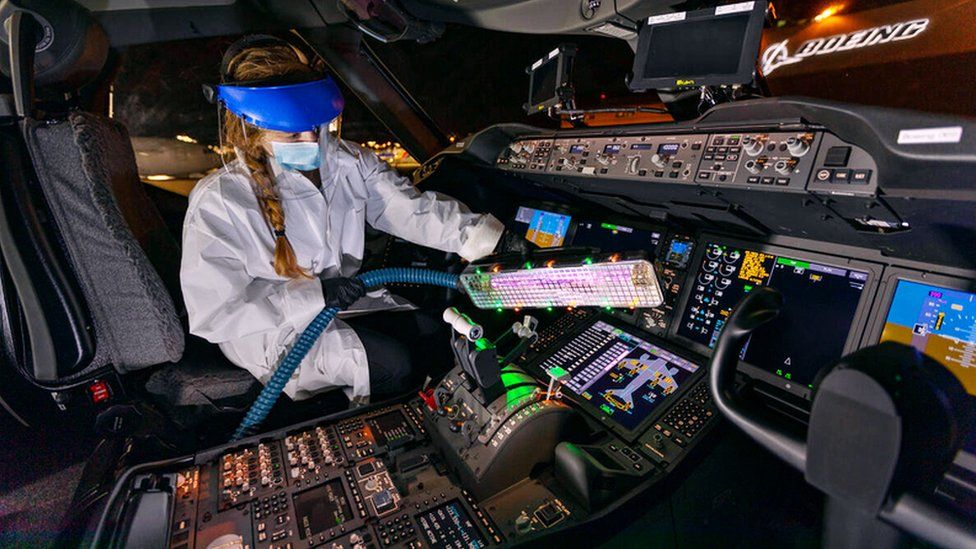 A worker using Boeing's 'UV wand'