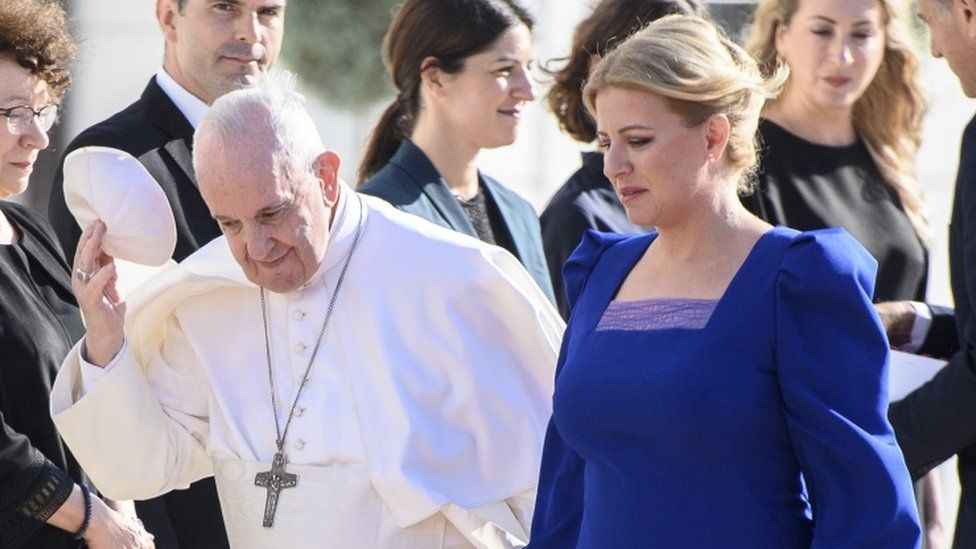 Slovak President Zuzana Caputova (R) welcomes Pope Francis at the Presidential Palace in Bratislava