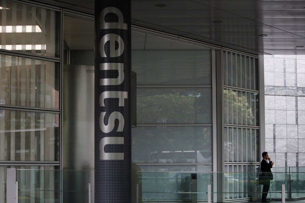 The entrance of the Dentsu's headquarters in Tokyo, 12 July 2016.