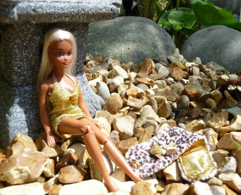 Pippa doll posing in sparkly gold outfit