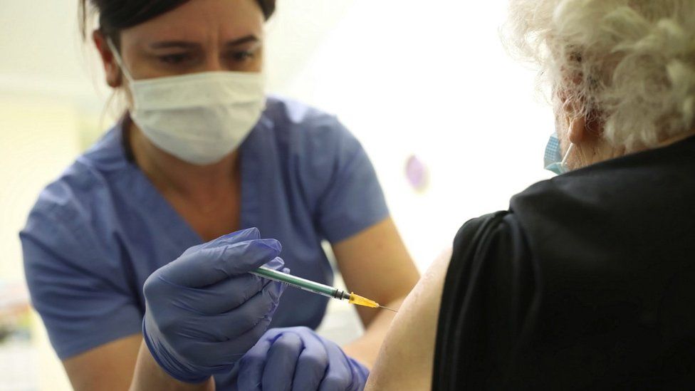 Polish vaccination of an elderly woman in Warsaw, 28 Jan 21