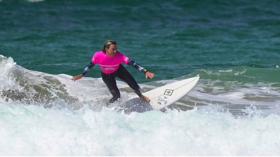 Lucy Campbell surfing