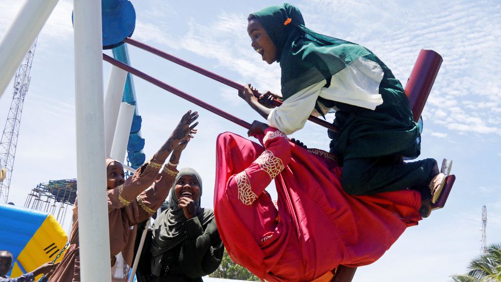 Girls on a swing in Mogadishu, Somalia - Monday 2 May 2022