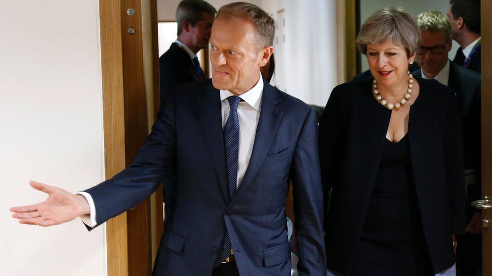 British Prime Minister Theresa May and European Council President Donald Tusk arrive before a meeting a EU leaders summit in Brussels on June 22, 2017