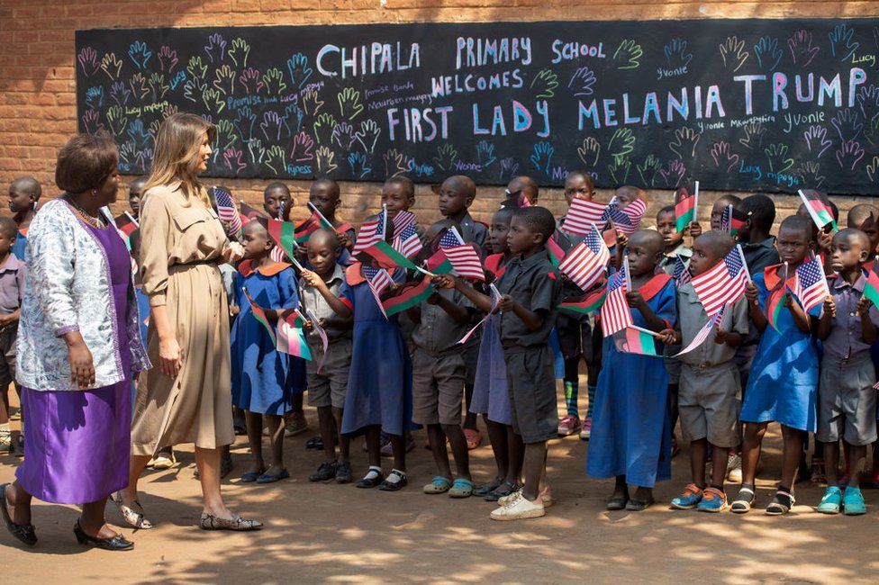 US First Lady Melania Trump (2nd L) visits Chipala Primary School alongside head teacher Maureen Masi (L) on October 4, 2018 during a 1-day visit in Malawi, part of her week long trip to Africa to promote her 'Be Best' campaign.