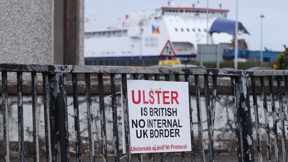 A sign that reads: Ulster is British. No internal UK border. Unionists against NI Protocol