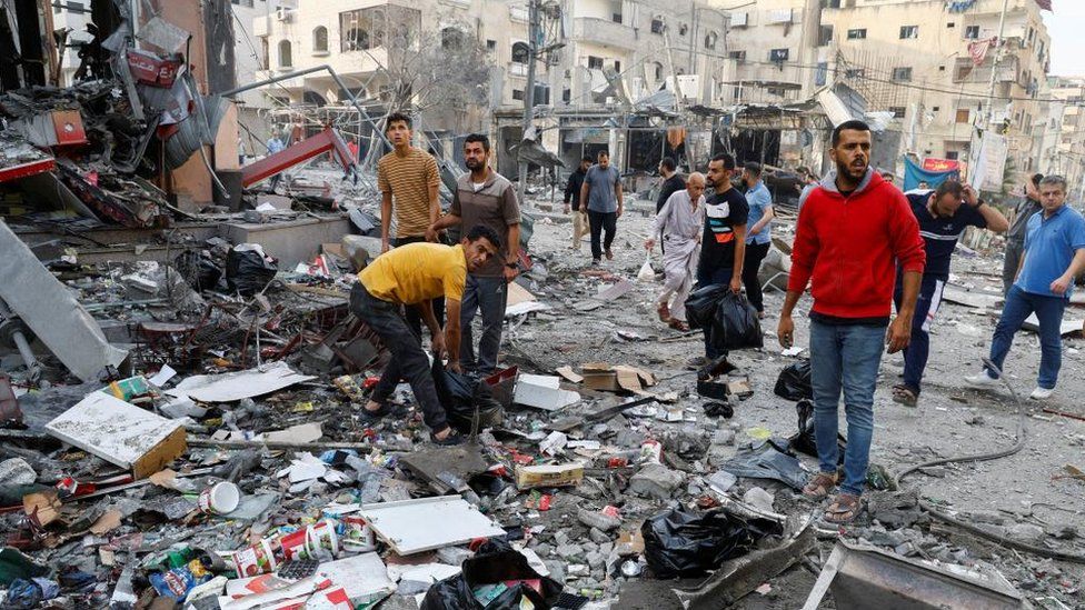 Palestinians at scene of air strike in northern Gaza Strip (13/10/23)