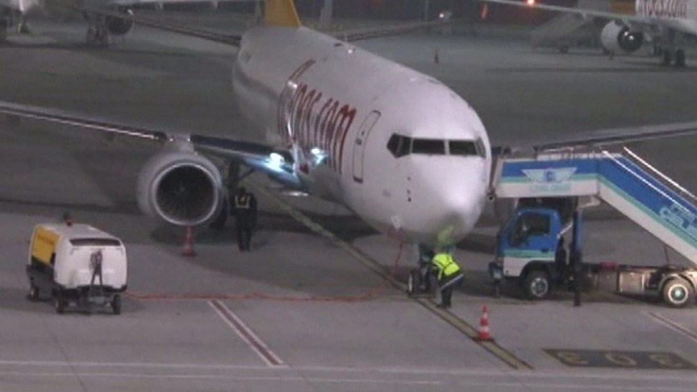 A plane parked at a Turkish airport after an explosion nearby