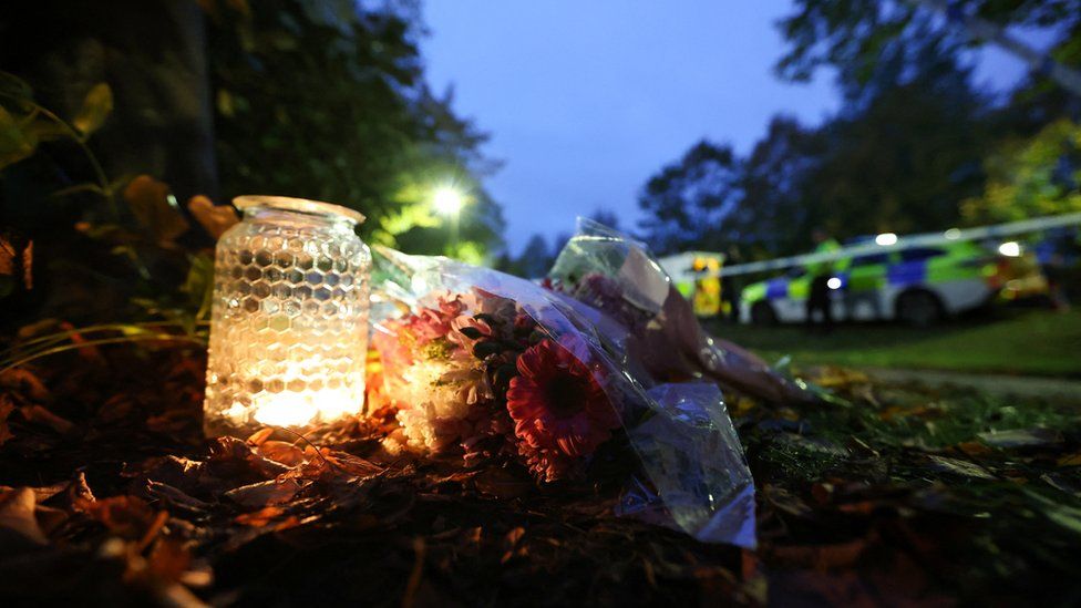 Flowers near police search at Loxbeare Drive in Furzton, Milton Keynes