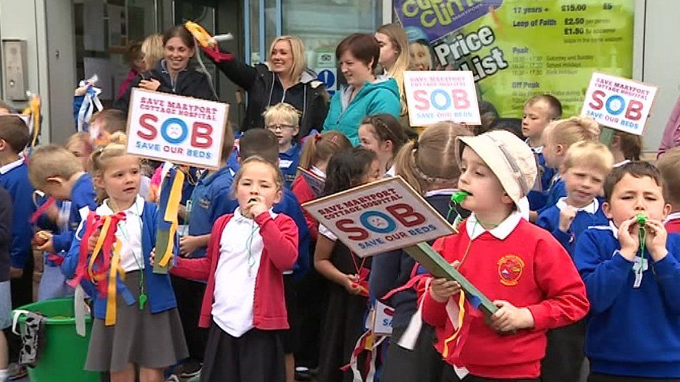 Schoolchildren protest the plan to close beds in Maryport in 2016