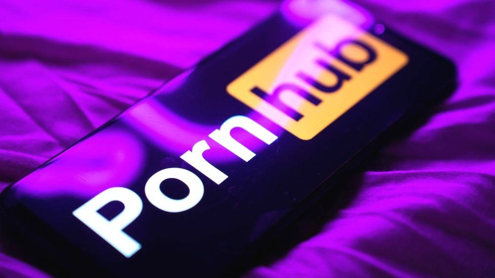 Pornhub owner to pay victims $1.8m in sex trafficking case - BBC News