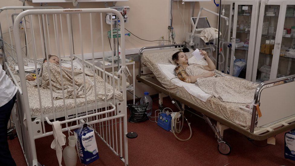 Two children rest in a Ukrainian hospital