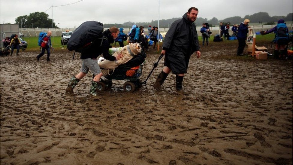 Arriving with a cart at muddy Glastonbury