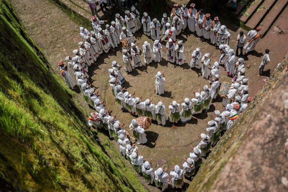 Young women sing during Ashenda festival, at Saint George Church, in Lalibela, Ethiopia.