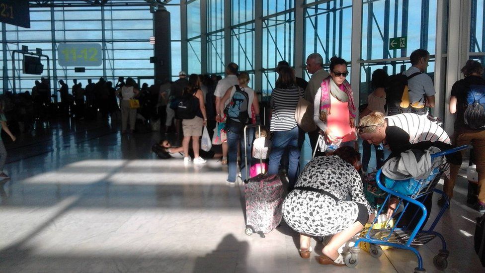 Easyjet passengers wait to board the replacement flight at Fuerteventura Airport