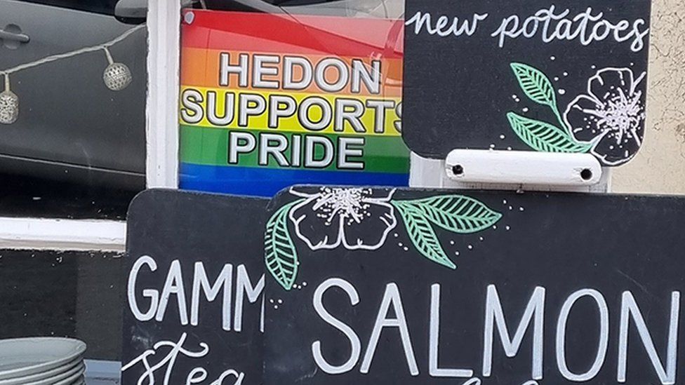 Pride flag in café window