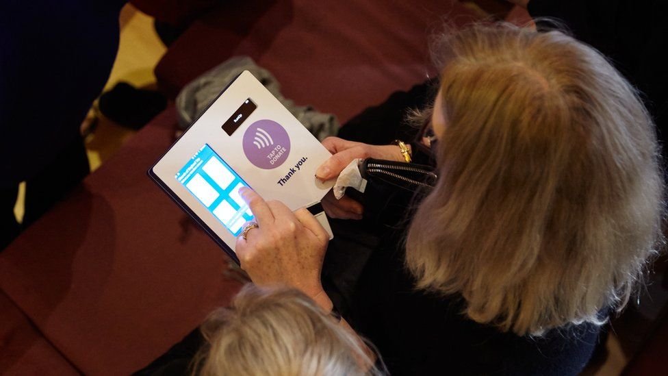 Image shows a contactless being made at a church