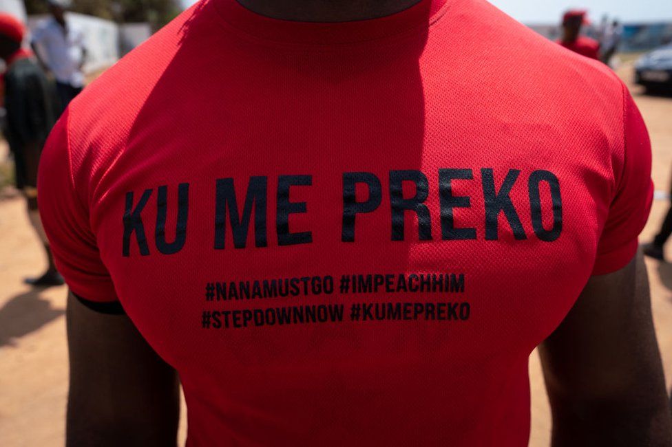 A demonstrator wears a "Ku Me Preko" t-shirt during the "Ku Me Preko" demonstration on November 5, 2022 in Accra, Ghana. People took to the streets of Ghana's capital to protest against the soaring cost of living, aggravated since the Russian invasion of Ukraine.