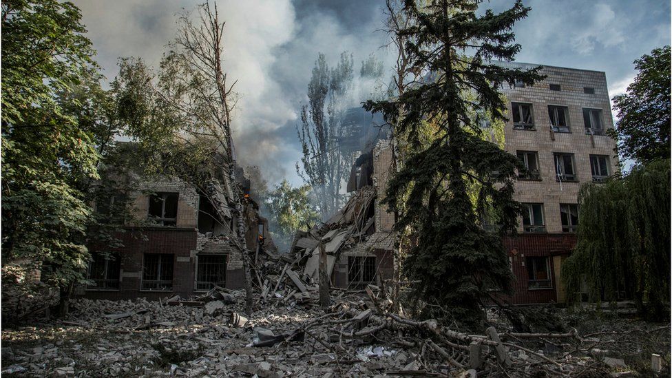 Smoke rises over the remains of a building destroyed by a military strike, as Russia's attack on Ukraine continues, in Lysychansk, Luhansk region, Ukraine June 17, 2022.