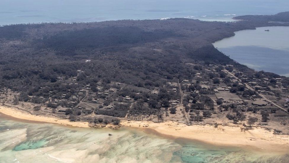 An aerial photo showing ash cloaking Tongan islands