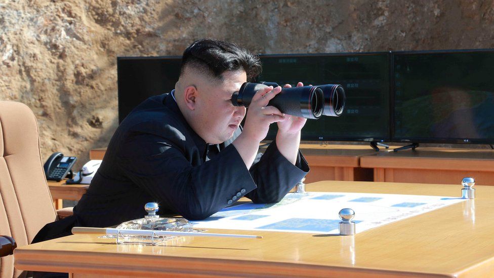 North Korean Leader Kim Jong Un looks on during the test-fire of inter-continental ballistic missile Hwasong-14 in this undated photo released by North Korea's Korean Central News Agency