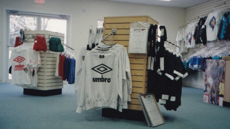 Old photo of Umbro jumpers on a rack in a sports shop