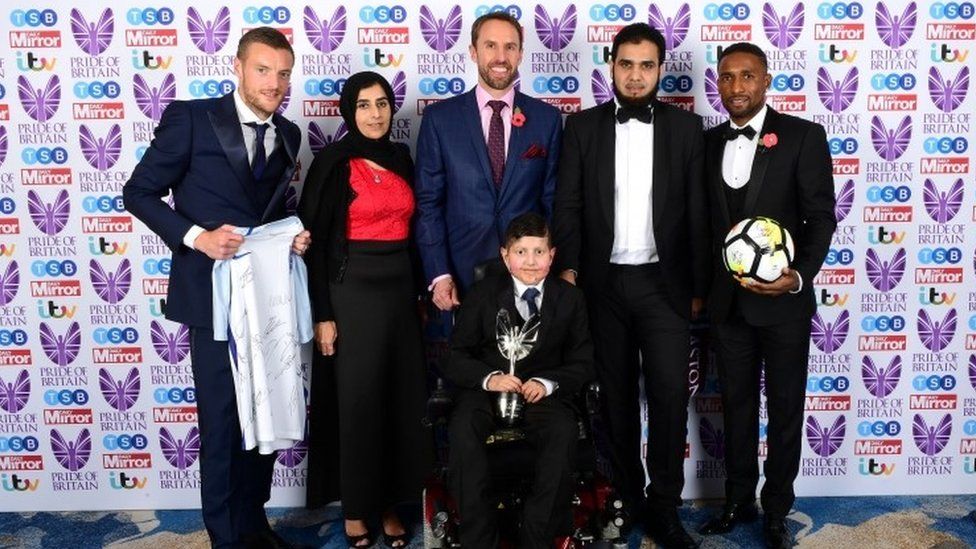 Gareth Southgate (centre back), Jermaine Defoe (right), and Jamie Vardy present Moin Younis the Child/Teenager of Courage award