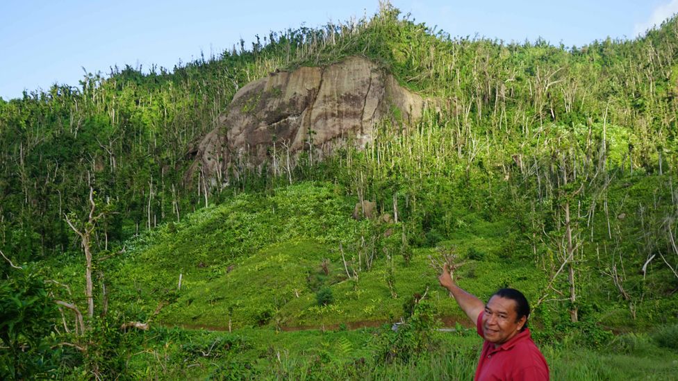 Former Kalinago Chief Irvince Nanichi Auguiste points at White Horse Rock