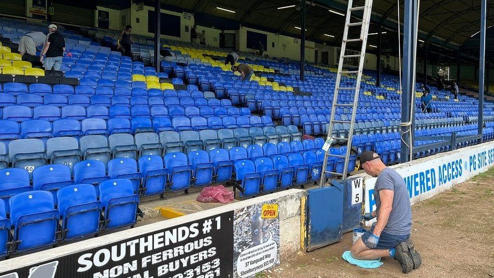 Southend United fans clearing up Roots Hall Stadium