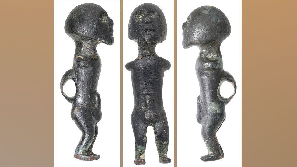 Front and side views of a male bronze 1st Century Celtic fertility figure 