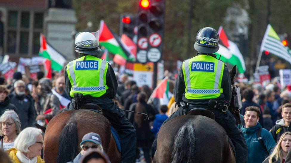 Horseback police amid the crowd during a pro-Palestinian protest on 28 October