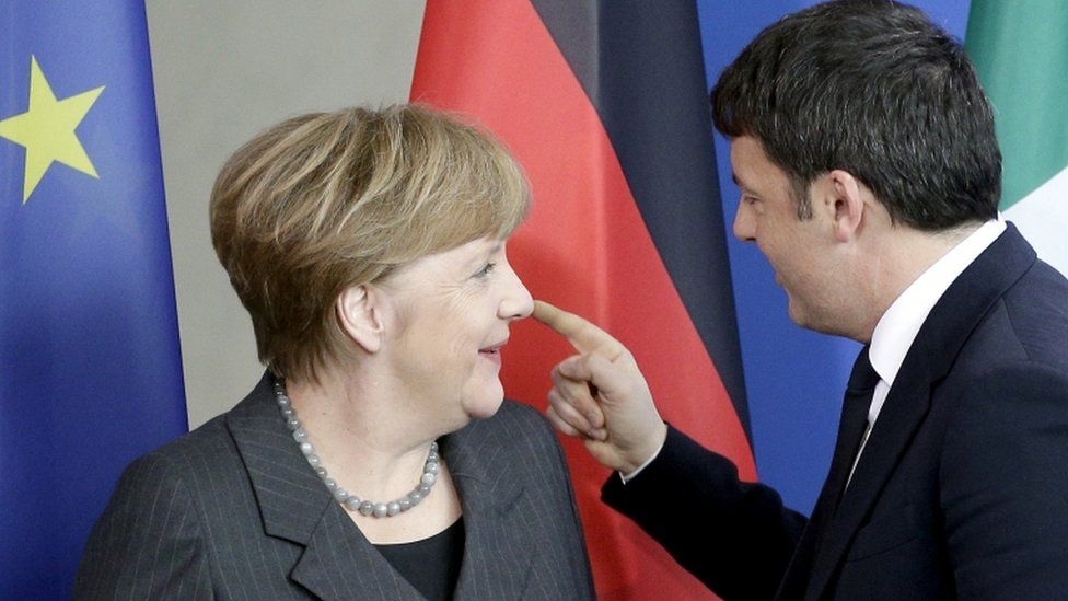 German Chancellor Angela Merkel, left, and Prime Minister of Italy Matteo Renzi,