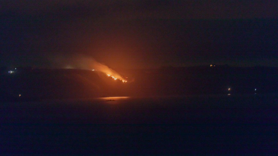 Sark west coast fire viewed from Guernsey
