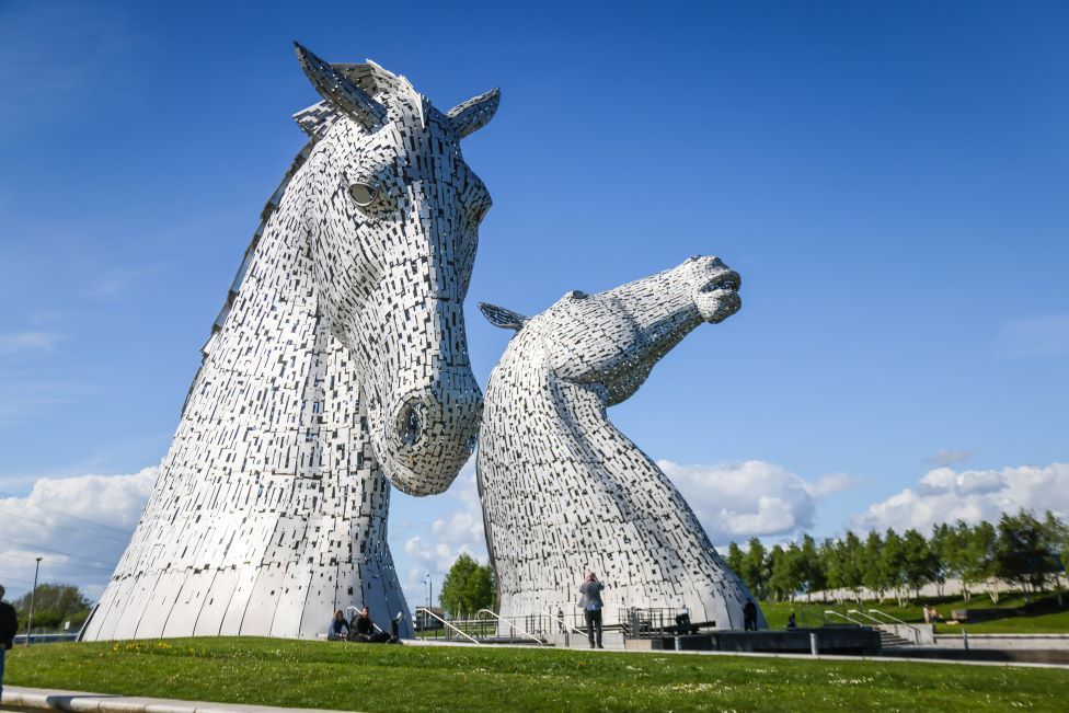 Climate change activists fined for scaling Kelpies - BBC News