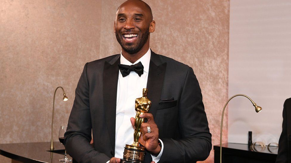 Kobe Bryant with an Oscar
