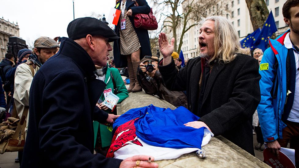 Two men argue at as pro and anti-Brexit protesters meet in Whitehall, London, January 2020
