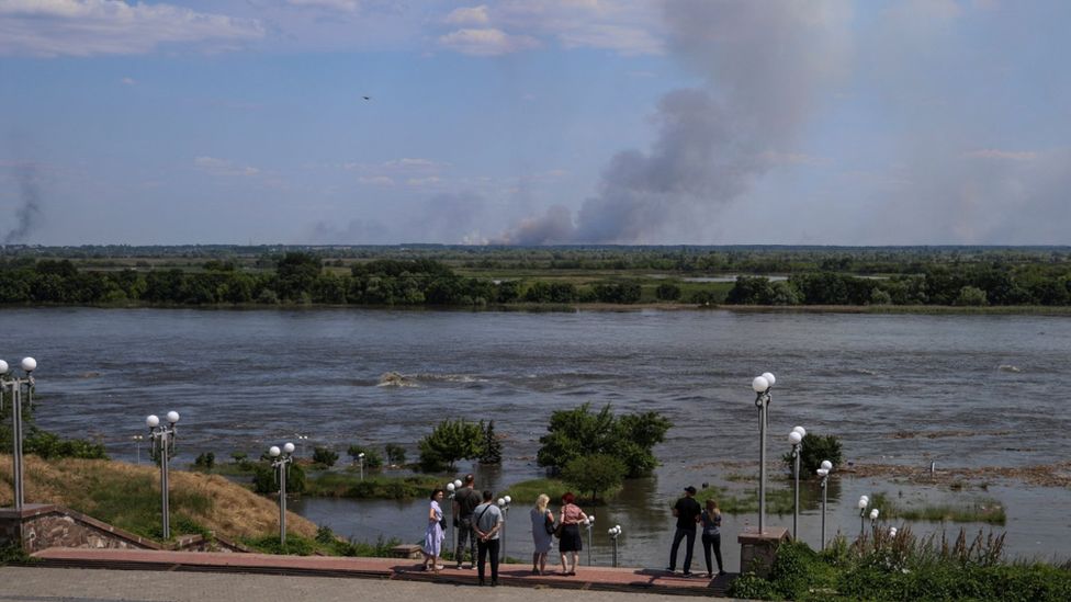 Residents in Kherson overlook flooding coming their way from the River Dnipro