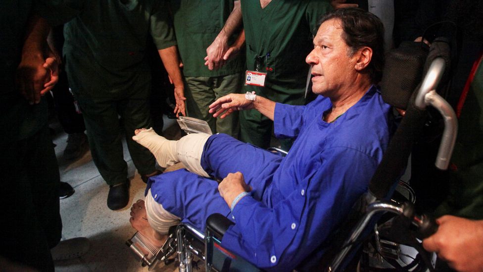 Imran Khan sits in a wheelchair at the Shaukat Khanum Memorial Cancer Hospital & Research Centre in Lahore