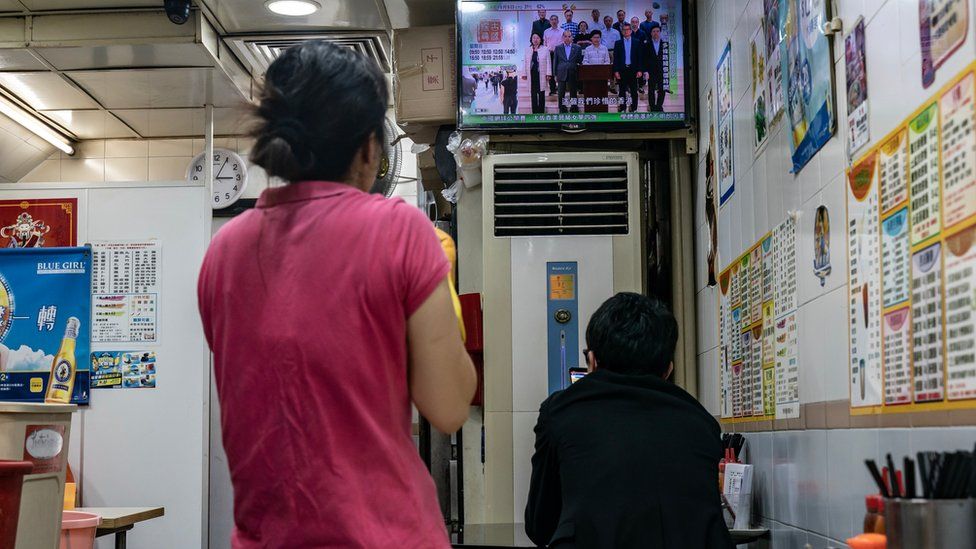 Customers watch a replay of Hong Kong Chief Executive Carrie Lam speaking on a television broadcast in a restaurant on October 5, 2019 in Hong Kong, China.