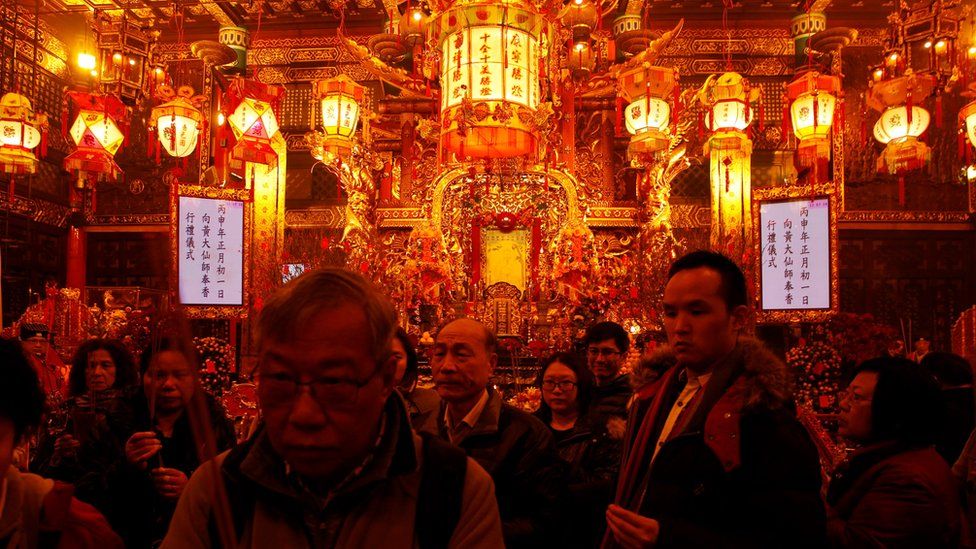 Worshippers make their first offerings inside Wong Tai Sin Temple, one of the busiest temples in Hong Kong, China February 7, 2016
