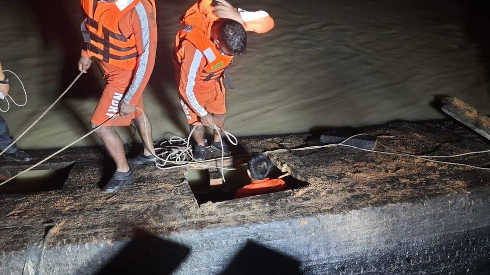 Rescue officials at the boat accident site