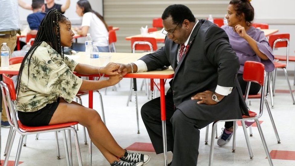 Tyra Hemans, a senior from Marjory Stoneman Douglas High School, speaks with Florida Rep. Wengay "Newt" Newton, (D-St. Petersburg), during a meeting at Leon High School after the students arrived in Tallahassee, Florida, US on 20 February 2018.