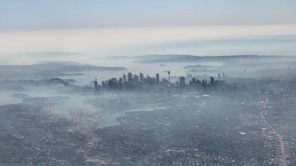 Aerial view of Sydney shrouded in smoke