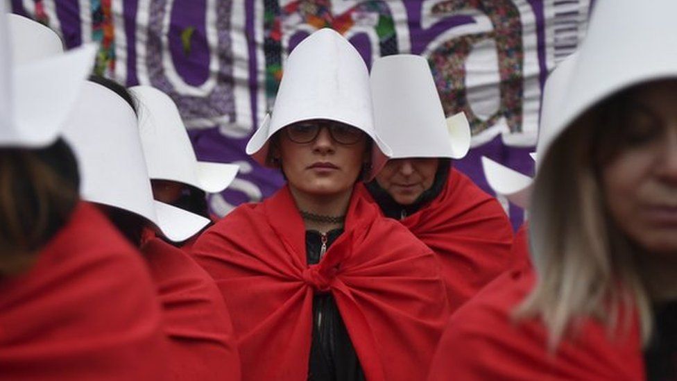 protesters in Argentina dressed as handmaids